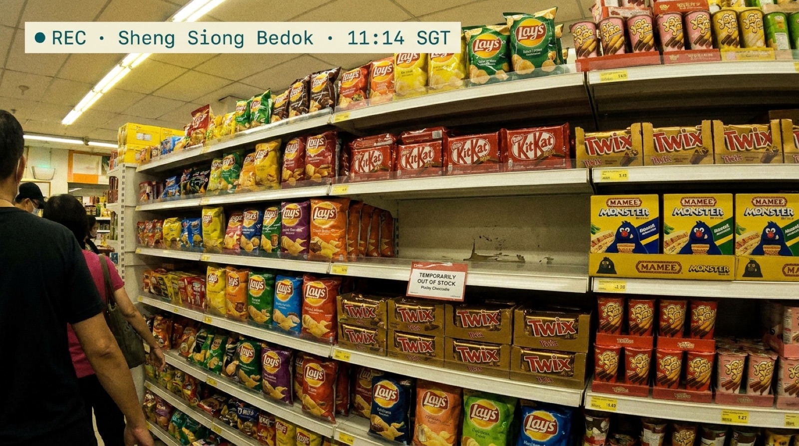 Sheng Siong snacks aisle with bounding-box overlays identifying KitKat, Lay's, Twix, Cadbury SKUs